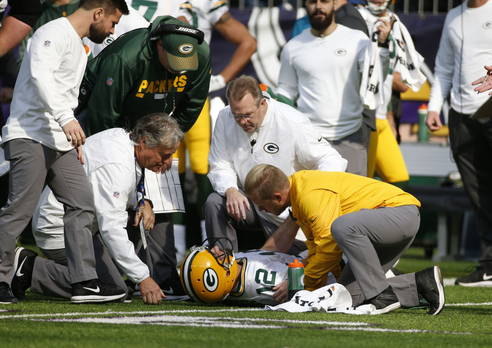 Medical staff attends to Aaron Rodgers, AP photo